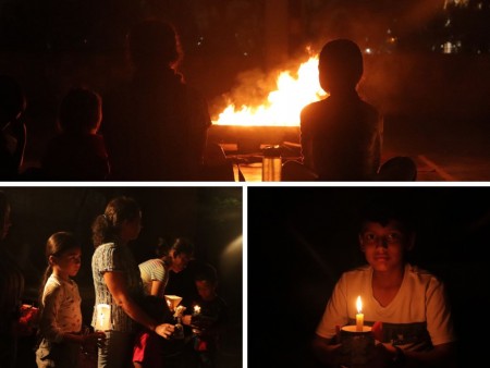 Feligreses de la Parroquia María Auxiliadora reunidos en torno a una fogata, preparándose para la solemnidad de su patrona en Comayagüela.